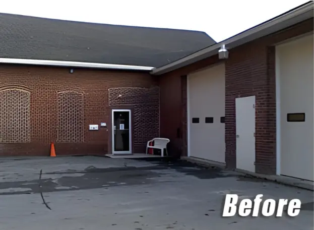 Brick building exterior before siding renovation showing weathered walls